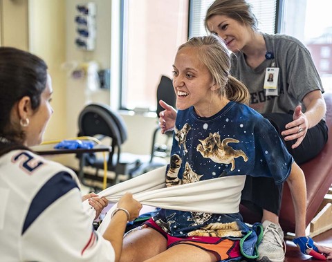 Caroline Moore, patient at Shepherd Center’s hospital, receives therapy